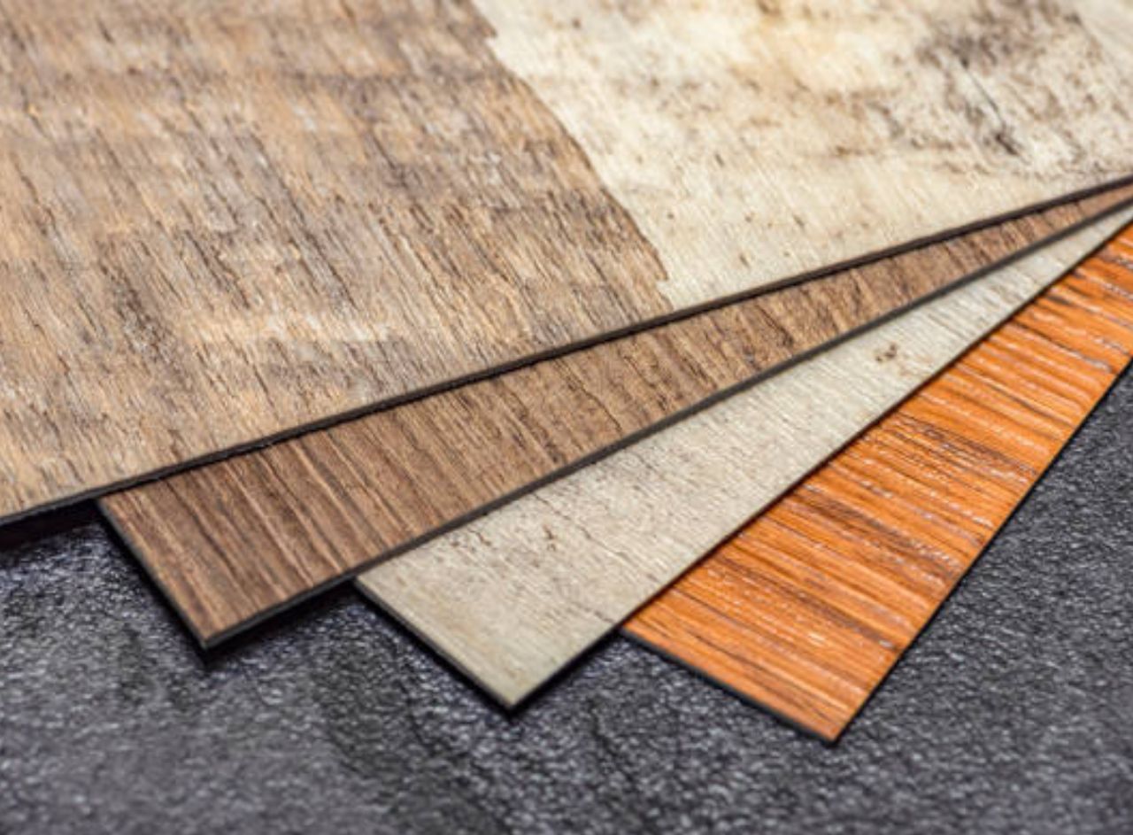 Samples of luxury vinyl plank flooring in various wood finishes.
